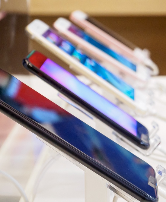 phones charging on display