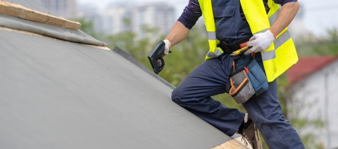 worker roofing