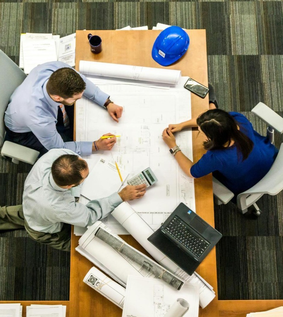 office-meeting-teamwork-collaboration-blueprints-planning