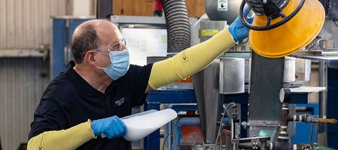 Technician Lary pouring polypropylene resin