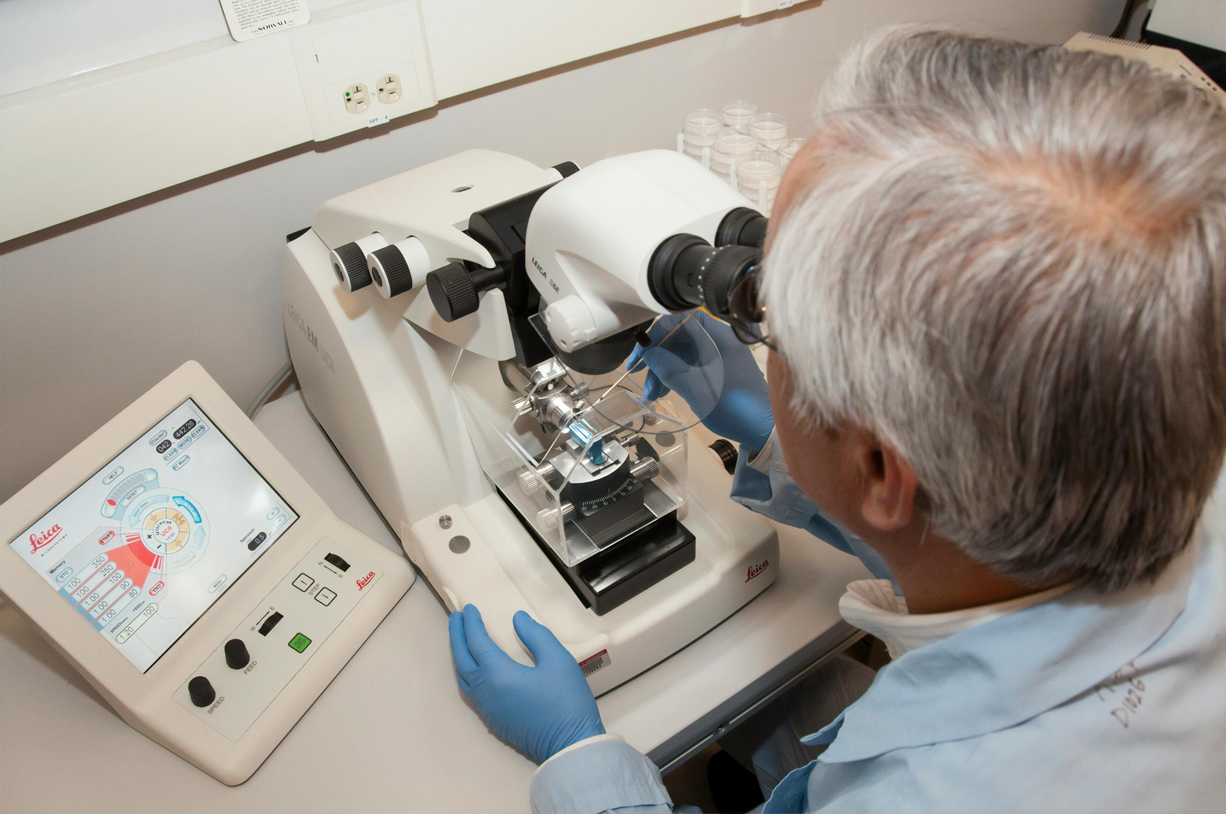 scientist-microscope-laboratory-research-equipment-analysis